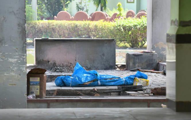 Cremation Of COVID-19 Victims In Rajasthan, India A dead body of COVID-19 victim at Hindu Moksha Dham crematorium looks deserted, amid coronavirus pandemic in Beawar. Beawar Rajasthan India Copyright: SumitxSaraswat
