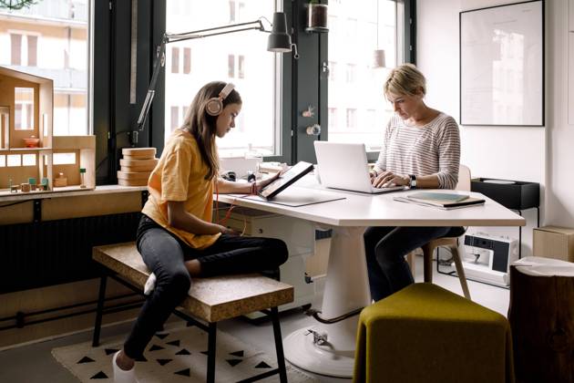 Businesswoman working while daughter learning through digital tablet at home Sweden, Stockholm, model released, property released Copyright: xMaskotx , MA86571