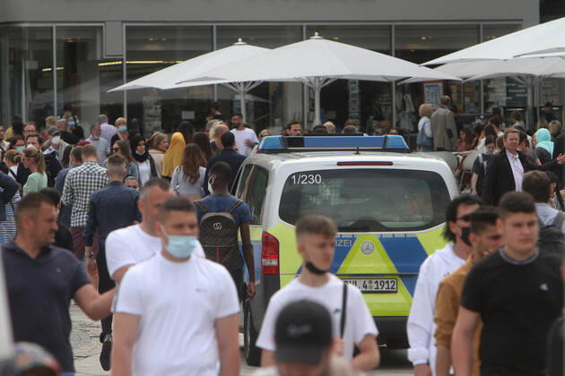 A police patrol of the state police Baden Württemberg controls the compliance with the minimum distances in the pedestrian zone and shopping street Königstraße at the Schlossplatz in the city centre of Stuttgart, Baden Württemberg, Bavaria, Germany