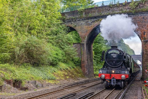 06 06 2021. Flying Scotsman The Flying Scotsman pulls into Winchester station on the return leg travelling between Paddington Station and Southampton Station, at Silchester, Hampshire, United Kingdom on 6 June 2021. Editorial use only , Copyright: xNigelxKeenex PSI-12870-0006