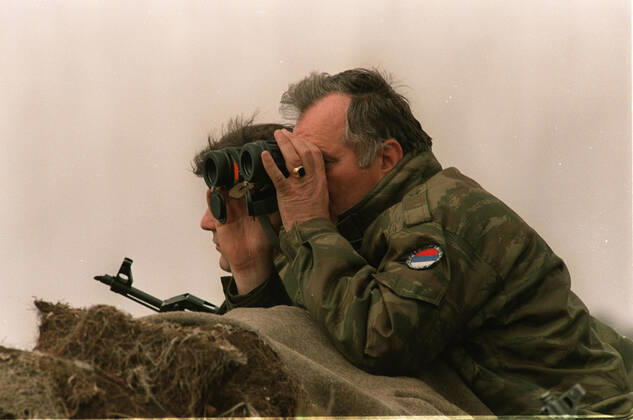 June 8, 2021: Former Bosnian Serb commander Ratko Mladic has lost his appeal against a 2017 conviction for genocide, war crimes and crimes against humanity. The UN court upheld the life sentence for his role in the killing of around 8,000 Bosnian Muslim (Bosniak) men and boys in Srebrenica in 1995. The massacre, in an enclave supposed to be under UN protection, was the worst atrocity in Europe since World War Two. FILE IMAGE SHOT ON: April 16, 1994, Gorazde, Bosnia and Herzegovina: Former Serb Army Commander RATKO MLADIC, right, near the town of Gorazde during the Bosnian War. Gorazde Bosnia and Herzegovina - ZUMAs107 19940416_jas_s107_001 Copyright: xDraganxStankovichx