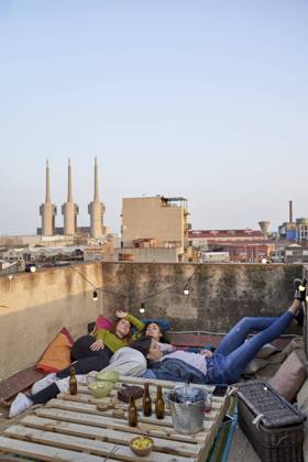 Female friends relaxing on rooftop model released Symbolfoto property released VEGF04292