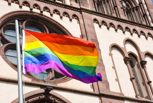 A rainbow flag flies at the Herz Jesu church in Freiburg, Germany