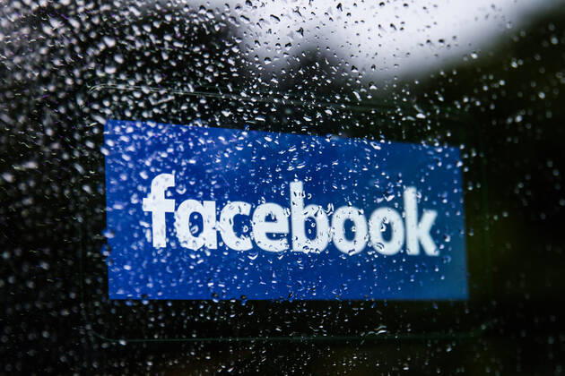 TikTok And Facebook Photo Illustrations Facebook logo displayed on a phone screen is seen through raindrops on the window in this illustration photo taken in Krakow, Poland on July 17, 2021. (Photo Ilustration by Jakub Porzycki NurPhoto) Krakow Poland porzycki-tiktokan210717_np6Ib  Copyright: xJakubxPorzyckix