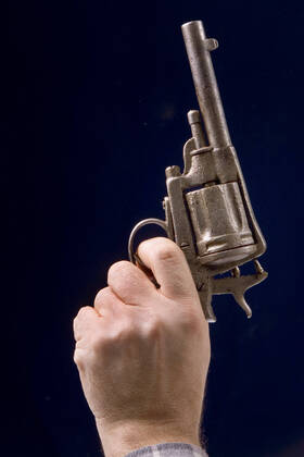 aiming with an old revolver BLWS650106 Copyright: xblickwinkel McPHOTO A.xSchauhuberx
