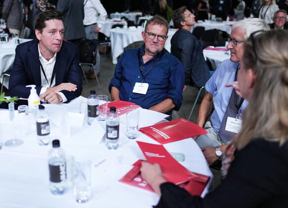 Prime Minister Mette Frederiksen S attends an intergovernmental conference on the Denmark of the future, which will take place in Fredericia on Tuesday 24 August 2021 The conference offers a number of speeches and workshops. Here Karre Dybvad, journalist Lars Olsen and associat Copyright: ClausxFisker ClausxFiskerx COP102 spdk20210824-140552-L