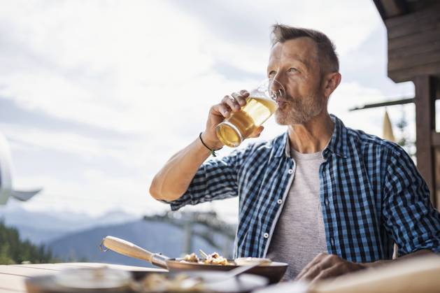 Man drinking beer while sitting at restaurant model released Symbolfoto DIGF16315