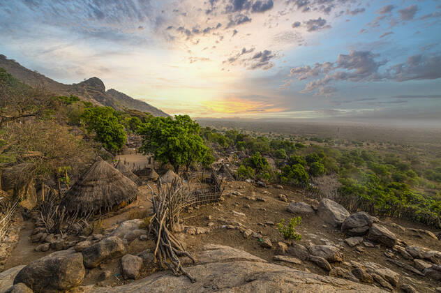 Sunset over traditional huts of the Otuho (Lotuko) tribe, Imatong mountains, Eastern Equatoria, South Sudan, Africa Copyright: MichaelxRunkel 1184-5857