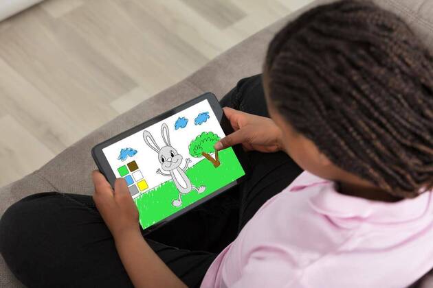  Girl Playing Leisure Game On Digital Tablet model released, Symbolfoto, 12.10.2020, Copyright: xAndreyPopovx Panthermedia22642327