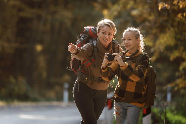 Fun In The Forest Shot of a teen girl and her mom using digital photo camera during walk together through the forest in autumn. Copyright: xMilanxMarkovicx 38801276