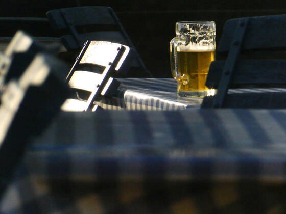 Employee chairs at a table in an outdoor restaurant catering