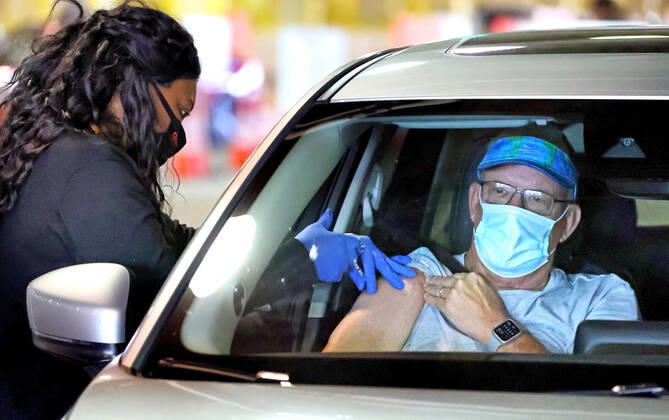 February 22, 2021, Orlando, FL, USA: A Florida resident gets vaccinated at the drive-thru site at the Orange County Convention Center in Orlando, Monday, Feb. 22, 2021. There has been a significant increase recently of newly vaccinated Floridians in the Latino and youth demographics. Orlando USA - ZUMAm67_ 1008078321st Copyright: xJoexBurbankx