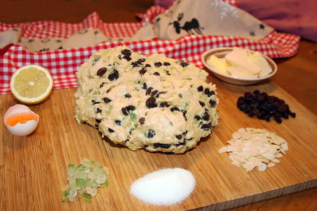 Dough and ingredients for the christmas stollen 1033003309
