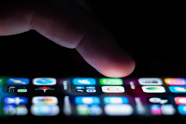 A man operates an iPhone SE on which numerous application apps are installed Rottweil Baden Württemberg Germany