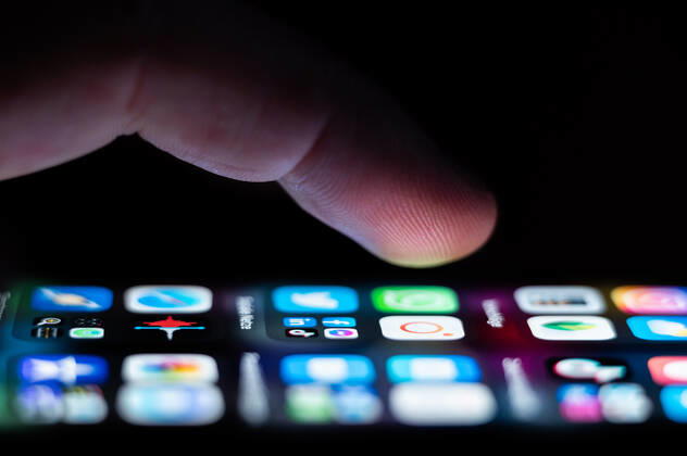 A man operates an iPhone SE on which numerous application apps are installed Rottweil Baden Württemberg Germany