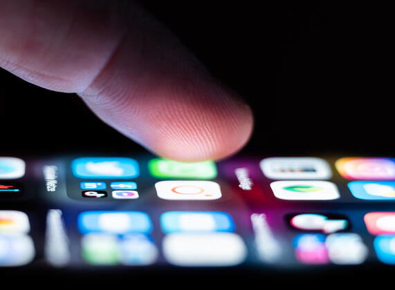 A man operates an iPhone SE on which numerous application apps are installed Rottweil Baden Württemberg Germany
