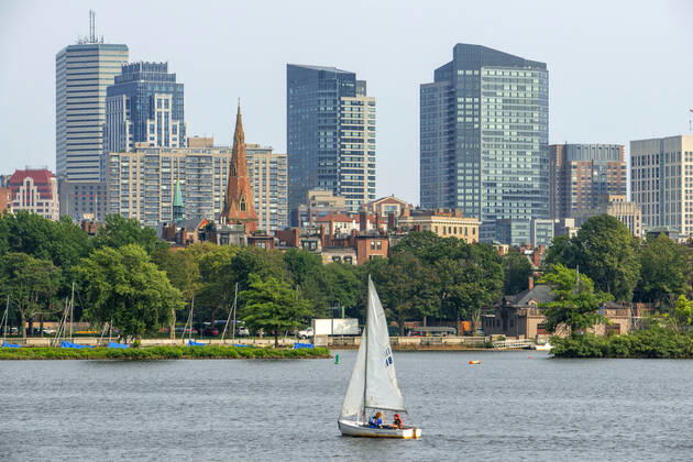 Sail boat in Boston Harbor, Boston against the cityscape of Back Bay Boston, Massachusetts, USA from across the Charles River Boston Massachusetts USA Copyright: xSergixReboredox SRE-EP0764
