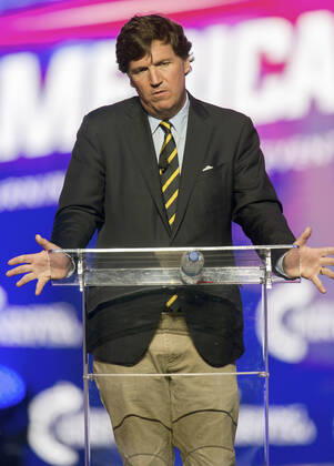 December 19, 2021 - Phoenix, Arizona, USA - Fox News host TUCKER CARLSON speaks at AmericaFest, a Turning Point USA event. Phoenix USA - ZUMAce6_ 20211219_zaf_ce6_004 Copyright: xBrianxCahnx