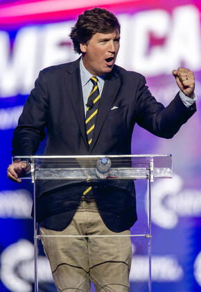 December 19, 2021 - Phoenix, Arizona, USA - Fox News host TUCKER CARLSON speaks at AmericaFest, a Turning Point USA event. Phoenix USA - ZUMAce6_ 20211219_zaf_ce6_005 Copyright: xBrianxCahnx