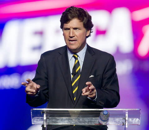 December 19, 2021 - Phoenix, Arizona, USA - Fox News host TUCKER CARLSON speaks at AmericaFest, a Turning Point USA event. Phoenix USA - ZUMAce6_ 20211219_zaf_ce6_008 Copyright: xBrianxCahnx