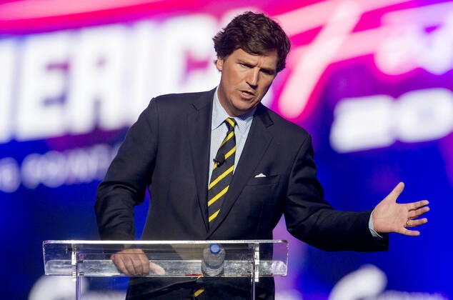 December 19, 2021 - Phoenix, Arizona, USA - Fox News host TUCKER CARLSON speaks at AmericaFest, a Turning Point USA event. Phoenix USA - ZUMAce6_ 20211219_zaf_ce6_010 Copyright: xBrianxCahnx