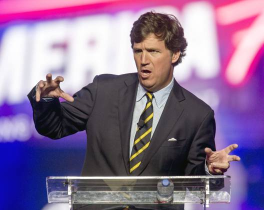 December 19, 2021 - Phoenix, Arizona, USA - Fox News host TUCKER CARLSON speaks at AmericaFest, a Turning Point USA event. Phoenix USA - ZUMAce6_ 20211219_zaf_ce6_011 Copyright: xBrianxCahnx