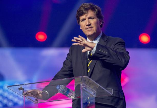 December 19, 2021 - Phoenix, Arizona, USA - Fox News host TUCKER CARLSON speaks at AmericaFest, a Turning Point USA event. Phoenix USA - ZUMAce6_ 20211219_zaf_ce6_014 Copyright: xBrianxCahnx