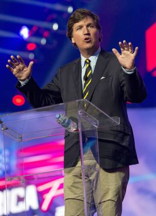December 19, 2021 - Phoenix, Arizona, USA - Fox News host TUCKER CARLSON speaks at AmericaFest, a Turning Point USA event. Phoenix USA - ZUMAce6_ 20211219_zaf_ce6_017 Copyright: xBrianxCahnx