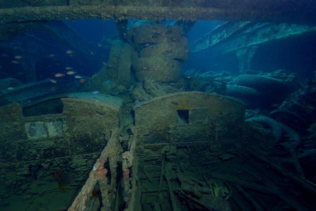 Old damaged sunken ship and on sandy bottom of blue Red Sea with reef fish ArturoVigil_RedSea_73.jpg Copyright: xArturoxVigilx Model Released