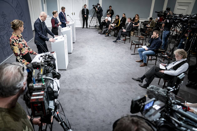 Prime Minister Mette Frederiksen S, Minister of Health Magnus Heunicke S, academic director of the Statens Serum Institut Tyra Grove Krause and director of the National Board of Health Soeren Brostroem during a press conference on the corona situation in the Mirror Room in the Prime Ministers Office, Wednesday 26 January 2022, Copenhagen Denmark  Copyright: RitzauxScanpix MadsxClausxRasmussenx cop104 spdk20220126-212752-L