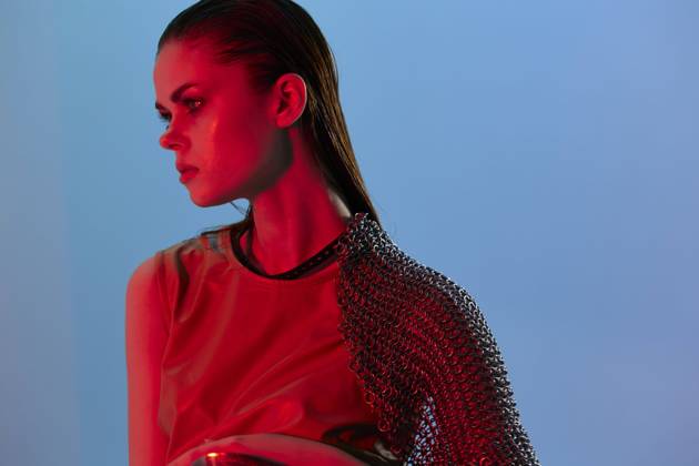 young woman in dress arm in armor chain mail protection isolated background young woman in dress arm in armor chain mail protection isolated background. High quality photo Copyright: xx 43636060