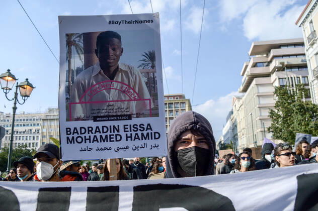 Greece: Protest against migrant pushbacks and border violence in Athens A protester holds a sign with the picture and the name of missing migrant, during a protest against migrant pushbacks and border violence. Athens Greece Copyright: DimitrisxAspiotis