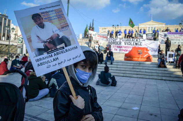 Greece: Protest against migrant pushbacks and border violence in Athens A young protester holds a sign with the picture and the name of missing migrant, during a protest against migrant pushbacks and border violence. Athens Greece Copyright: DimitrisxAspiotis