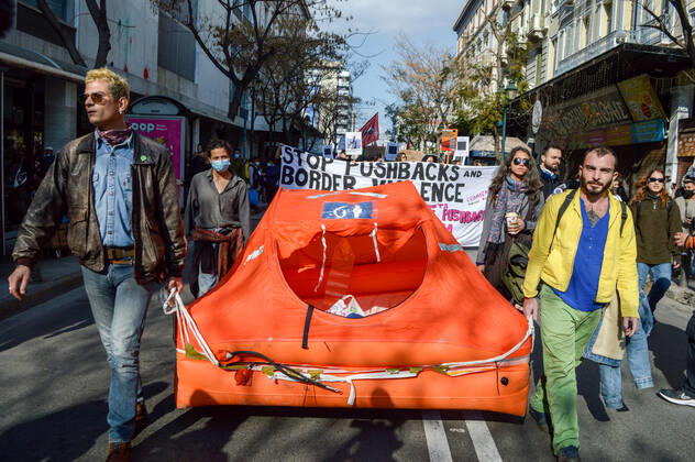 Greece: Protest against migrant pushbacks and border violence in Athens Protesters carry an inflatable dinghy, used largely by migrants to cross the seas from Turkey during a protest march against migrant pushbacks and border violence. Athens Greece Copyright: DimitrisxAspiotis
