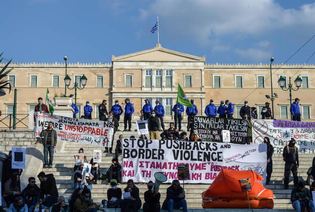 Greece: Protest against migrant pushbacks and border violence in Athens Protesters hold signs and banners reading Stop pushbacks and border violence as they stand next to a life raft with the Greek Parliament in the background in Syntagma square. Hundreds of protesters hit the streets of the Greek capital on Sunday, to protest what they say are Greece’s pushbacks of migrants and refugees at the border with Turkey. Athens Greece Copyright: DimitrisxAspiotis