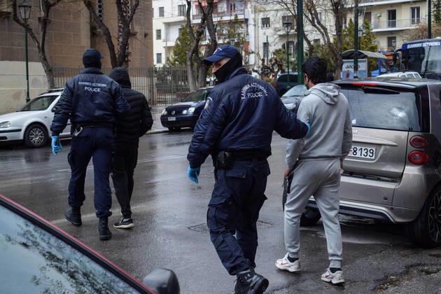Greek Police detain irregular migrants without legal documents Greek Police officers detain irregular migrants without legal residence permit in the Aghios Panteleimonas area in central Athens, a district with high immigrant population. Athens Greece Copyright: DimitrisxAspiotis