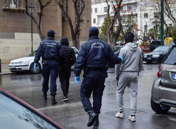 Greek Police detain irregular migrants without legal documents Greek Police officers detain irregular migrants without legal residence permit in the Aghios Panteleimonas area in central Athens, a district with high immigrant population. Athens Greece Copyright: DimitrisxAspiotis
