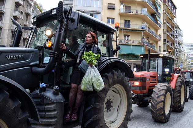 Greece: Farmers protest against an increase in production costs A woman farmer is seen on a tractor while Farmers hold tractor rally in front of the Ministry of Agricultural Development protesting against an increase in production costs. Athens Greece Copyright: DimitrisxAspiotis
