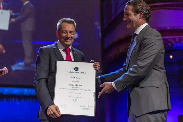 Switzerland: Foundation Award Ceremony for Geneva 2022 Peter Maurer (President of ICRC) (L) receives the Foundation Prize for Geneva for his work with the International Committee of the Red Cross, from the hand of the Marc Pictet (Director of the Pictet group) (R) during the Foundation Award Ceremony for Geneva 2022. Geneva Switzerland Switzerland Copyright: EricxDubost