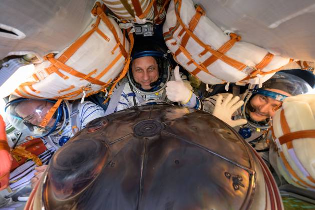 Expedition 66 crew members Mark Vande Hei of NASA, left, cosmonauts Anton Shkaplerov, center, and Pyotr Dubrov of Roscosmos, are seen inside their Soyuz MS-19 spacecraft after is landed in a remote area near the town of Zhezkazgan, Kazakhstan, on Wednesday, March 30, 2022. Vande Hei and Dubrov are returning to Earth after logging 355 days in space as members of Expeditions 64-66 aboard the International Space Station. For Vande Hei, his mission is the longest single spaceflight by a U.S. astronaut in history. Shkaplerov is returning after 176 days in space, serving as a Flight Engineer for Expedition 65 and commander of Expedition 66. NASA WAX2022033001 BILLxINGALLS