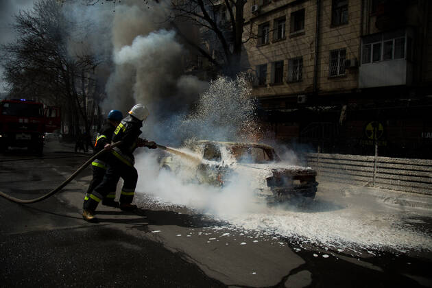 April 3, 2022, Mykolaiv, Ukraine: Mykolaiv, Ukraine. 03 April 2022. A civilian car ablaze following an alleged Russian bombing in the southern city of Mikolaiv. Firefighters attended the site and put out the fire in the strategic port city of Mikolaiv, which has previously been under attack by Russian forces in their attempt to gain strategic control of the Black Sea coastline Mykolaiv Ukraine - ZUMAd99_ 20220403_zap_d99_006 Copyright: xLouaixBarakatx
