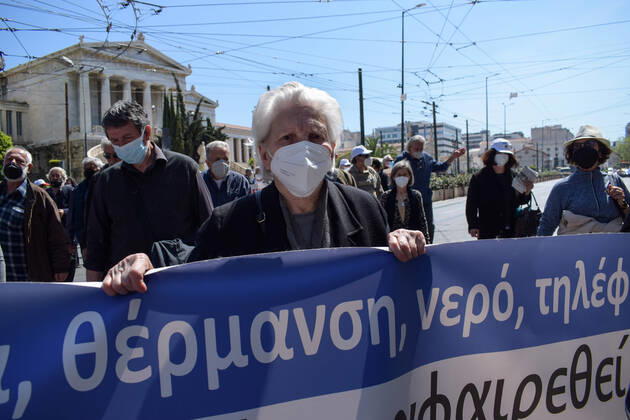 Greece: Thousands take to Athens streets in protest of price hikes Senior woman pensioner protests holding a banner with slogans against soaring unbearable prices that plague Greek society. Athens Greece Copyright: DimitrisxAspiotis