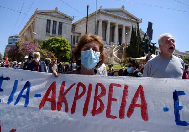 Greece: Thousands take to Athens streets in protest of price hikes Senior woman pensioner seen marching holding a banner that reads Price Hikes in protest of soaring unbearable prices that plague Greek society. Athens Greece Copyright: DimitrisxAspiotis