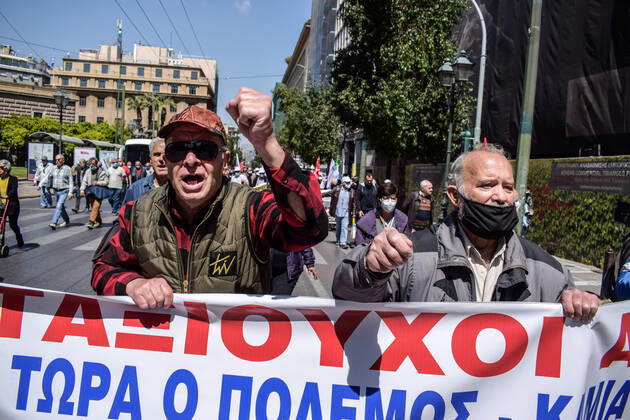 Greece: Thousands take to Athens streets in protest of price hikes Pensioners protest holding banner that reads: No involvement of Greece in the war. Increase wages and pensions. Decrease prices of basic needs Athens Greece Copyright: DimitrisxAspiotis