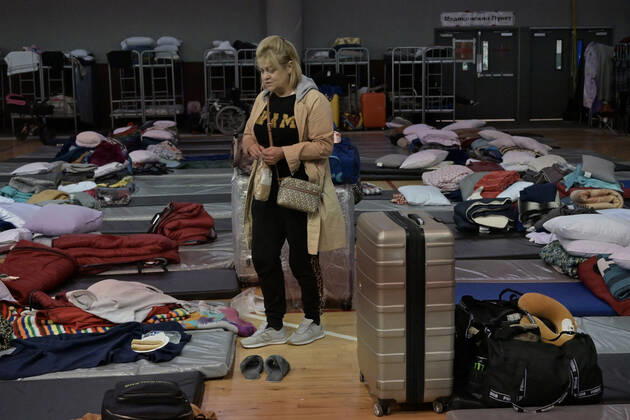 April 21, 2022, Tijuana, Baja California, Mexico: Ukrainian refugees waiting for their turn to get bused for processing to enter the U.S. at the Benito Juarez Sports Complex in Tijuana, Mexico on Thursday, April 21, 2022. ..The Biden Administration announced today that the United States will no longer accept Ukrainian refugees who arrive at the U.S.-Mexico border to seek asylum, instead they will proceeded directly when arriving only via Europe to the States...The move is expected to speed up the processing of applications for Ukrainian refugees and others fleeing war, but it will no longer routinely grant entry to anyone who shows up at the border which thousands have done so previously since the Russian invasion of Ukraine on February 24. - ZUMAm180 20220421_zip_m180_008 Copyright: xCarlosxA.xMorenox