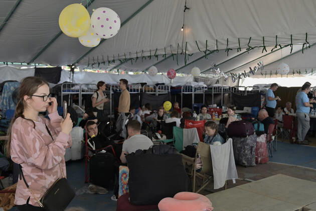 April 21, 2022, Tijuana, Baja California, Mexico: Ukrainian refugees waiting for their turn to get bused for processing to enter the U.S. at the Benito Juarez Sports Complex in Tijuana, Mexico on Thursday, April 21, 2022. ..The Biden Administration announced today that the United States will no longer accept Ukrainian refugees who arrive at the U.S.-Mexico border to seek asylum, instead they will proceeded directly when arriving only via Europe to the States...The move is expected to speed up the processing of applications for Ukrainian refugees and others fleeing war, but it will no longer routinely grant entry to anyone who shows up at the border which thousands have done so previously since the Russian invasion of Ukraine on February 24. - ZUMAm180 20220421_zip_m180_009 Copyright: xCarlosxA.xMorenox