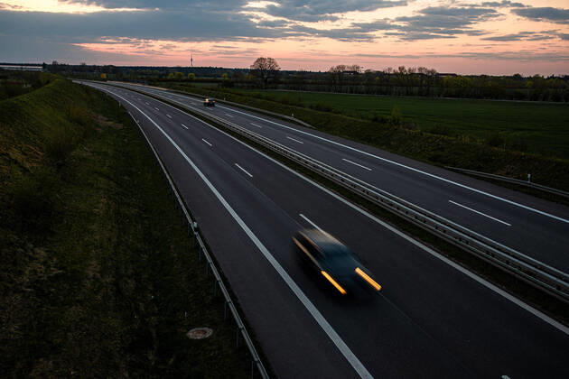 Cars on a country road in the evening of 23 April 2022 Cars on road