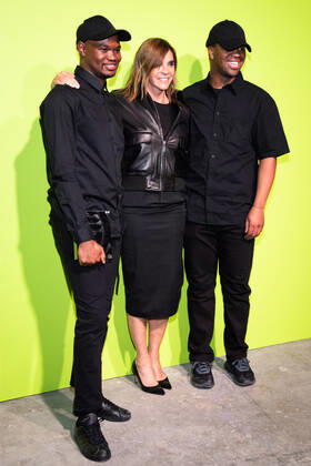 International Woolmark Prize 2022 London, UK. Carine Roitfeld (C) poses with Mmuso Potsane and Maxwell Boko of MmusoMaxwell, at the Photocall at the International Woolmark Prize 2022 FINAL in London on 26th April 2022. LMK405-S260422LSAN-001 