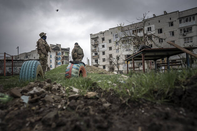 Secret service members guard in a destroyed neighborhood by Russian missiles, in advance of a visit from Romanian Prime Minister Nicolae Ciuca in Borodyanka, Ukraine, on Tuesday, April 26, 2022. U.S. Secretary of State Antony Blinken told Congress on Tuesday that the Biden administration hasn t seen any evidence that Russian President Vladimir Putin plans to end the war in Ukraine through diplomatic efforts.  KYV22020426509 KenxCedeno