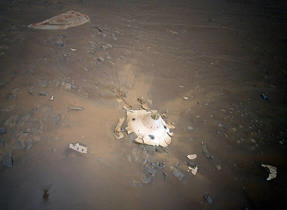 These amazing images, published Wednesday (27April2022) show NASA?s Ingenuity Mars Helicopter surveying the debris of both the parachute that helped the agency?s Perseverance rover land on Mars and the cone-shaped backshell that protected the rover in deep space and during its fiery descent toward the Martian surface on Feb. 18, 2021. Engineers with the Mars Sample Return program asked whether Ingenuity could provide this perspective. What resulted were 10 aerial colour images taken 19 April during Ingenuity?s Flight 26. NASA extended Ingenuity flight operations to perform pioneering flights such as this, said Teddy Tzanetos, Ingenuity?s team lead at NASA?s Jet Propulsion Laboratory in Southern California. Every time we Copyright: xx 51463224 EDITORIAL USE ONLY. NOT FOR USE BY NEWSPAPERS BASED IN THE UK.